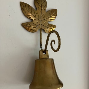 Handmade vintage brass leaf with hanging bell. Swedish vintage 1960s.