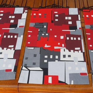 Three red and brown decorative wall panels. Swedish vintage fabric.