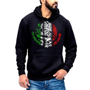 May include: Black hooded sweatshirt with a white graphic of the Mexican coat of arms, featuring an eagle perched on a cactus with a snake in its beak. The eagle is surrounded by a green, white, and red circle.