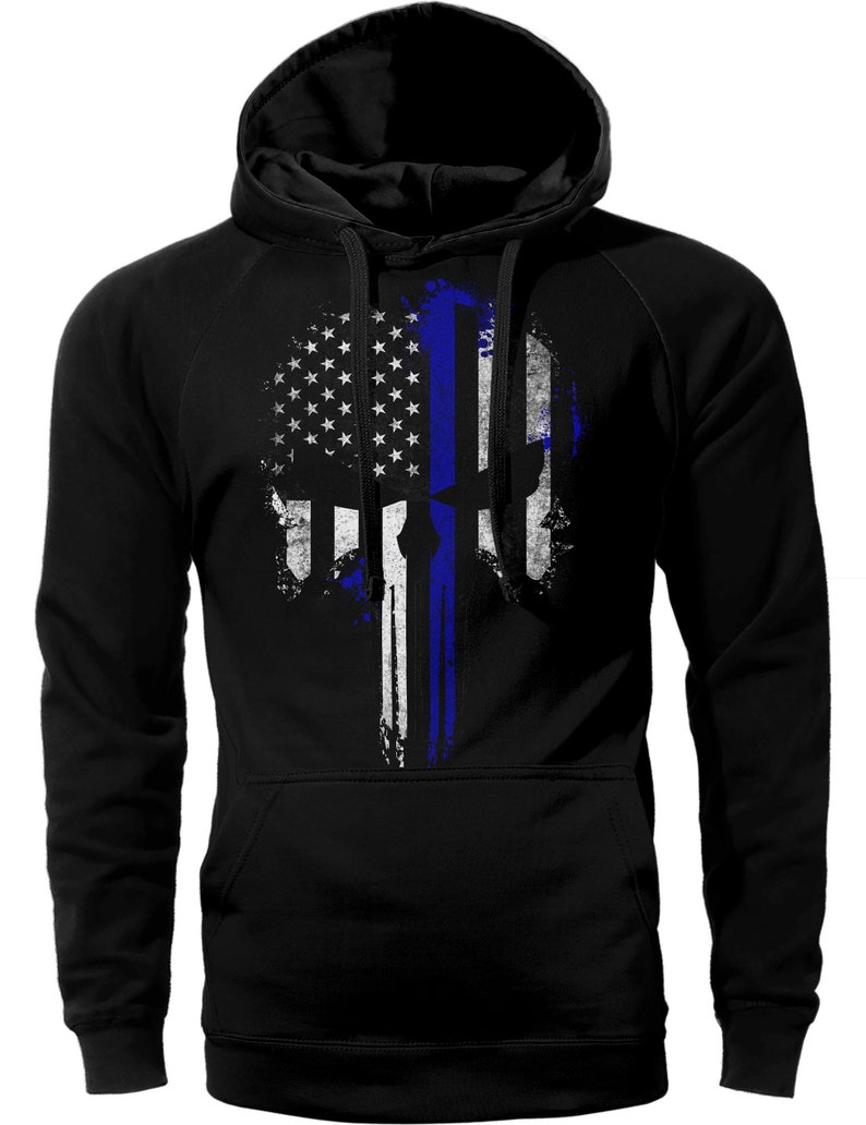 May include: Black hooded sweatshirt with a distressed American flag design featuring a blue line and a skull.