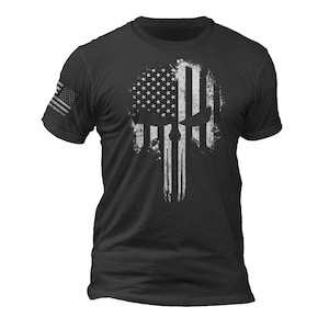 May include: Black t-shirt with a white distressed American flag design in the shape of a skull.
