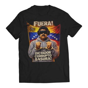 May include: Black t-shirt featuring a graphic of a man in handcuffs with the Venezuelan flag in the background. The text "FUERA!" is above the man's head, and "DICTADOR CORRUPTO BASURA!" is below.