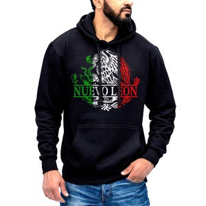 May include: Black hooded sweatshirt with a white eagle and snake graphic, surrounded by a red, white, and green circle. The text "NUEVO LEON" is printed below the graphic.