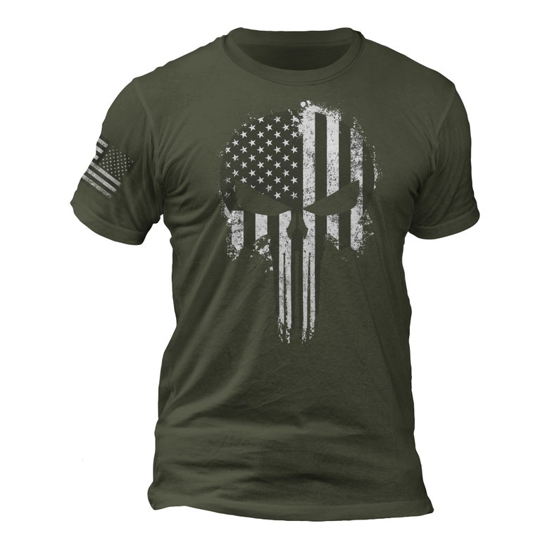 May include: A green t-shirt with a white distressed American flag skull graphic.