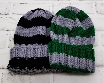 May include: Two striped knit hats, one black and grey, the other green and grey.