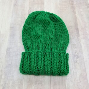 Sample of Cascade Adult Hat Knitting Pattern knit with green yarn.
