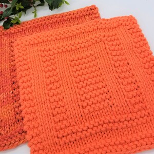 Samples of Spainhour Thanksgiving dishcloth knitting pattern knit with orange yarn