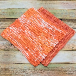 Samples of Spainhour Thanksgiving dishcloth knitting pattern knit with orange yarn