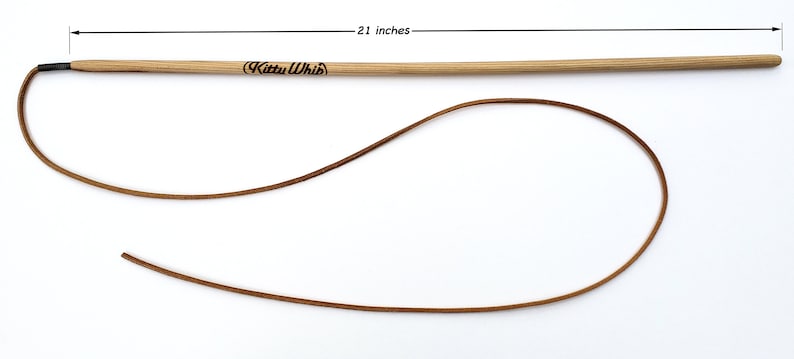 The KittyWhip Leather® wand cat toy displayed against a white background  with the length of the wooden handle detailed as 21 inches.