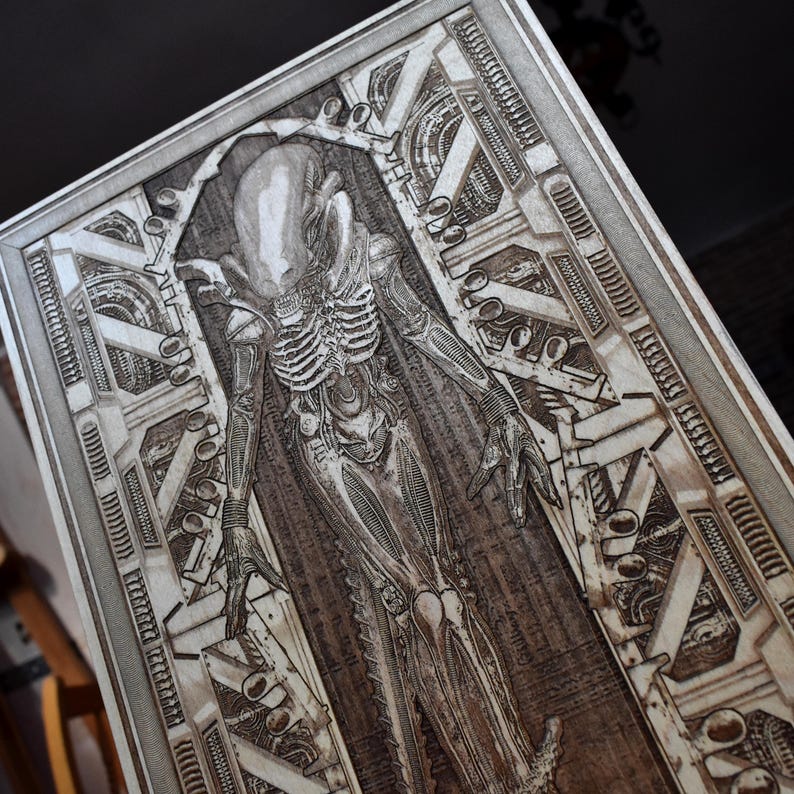 Sci fi creature wall art with detailed biomechanical skeletal design