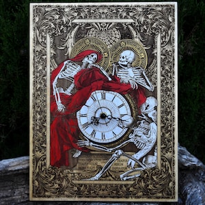 May include: Wooden wall art featuring a gothic design with skeletons, a clock, and ornate detailing. The skeletons are draped in red fabric. The clock face has Roman numerals. The artwork includes Latin text.