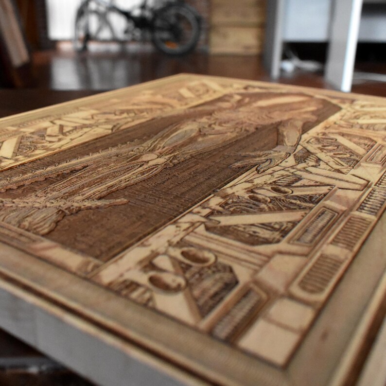 Space horror wood artwork featuring dark otherworldly monster engraving
