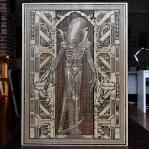 Extraterrestrial horror creature wood art laser engraved on natural maple