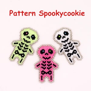 May include: Three skeleton figures crafted from small beads, featuring the text Pattern Spookycookie. The skeletons are colored in light green, bright pink, and white, each with black bead details for the ribcage, eyes, and mouth structure.