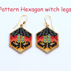 May include: A pair of gold hexagon-shaped earrings with a beaded design featuring black, red, orange, yellow, green, and blue beads. The earrings are in the shape of witch legs.