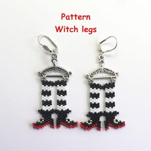 May include: A pair of earrings featuring beaded witch legs. The legs are black and white striped with red shoes. The earrings hang from silver-colored decorative hangers. The text "Pattern Witch legs" is in the upper left corner.