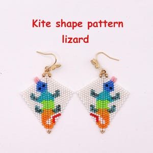 May include: A pair of kite-shaped beaded earrings featuring a lizard design with a white background and colorful segments in blue, green, and orange. The earrings hang from gold-toned metal hooks. The text Kite shape pattern lizard is visible.