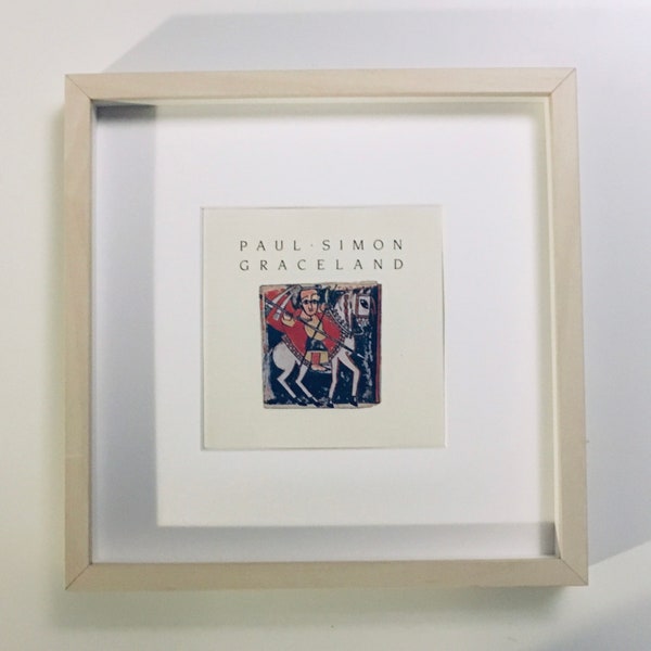 Paul Simon - Graceland / Le rythme des saints : véritable pochette de CD encadrée