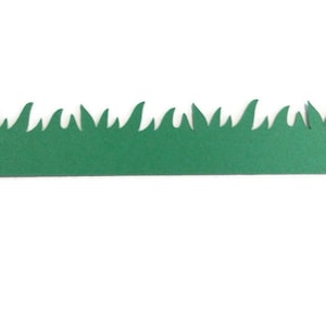 May include: A green grass border with a jagged edge, perfect for adding a touch of nature to crafts and projects.