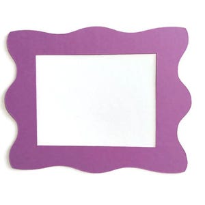 May include: A purple picture frame with a wavy, scalloped edge. The frame has a rectangular opening for a photo or artwork. The frame is made of a solid, opaque material and is set against a white background.