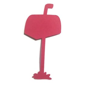 May include: A red paper cutout of a mailbox with a flag on top. The mailbox is standing on a small base.
