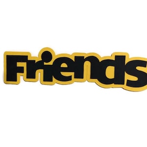 May include: A black and yellow sticker with the word "Friends" in bold, black letters.