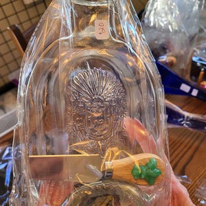 Repurposed wine/alcohol bottle cheese trays, spoon rests, and candle holders
