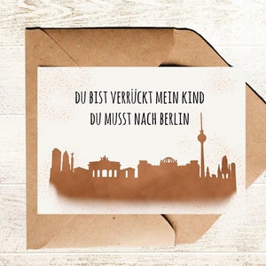 Berlin Postkarte mit Spruch Du bist verrückt mein Kind du musst nach Berlin und Skyline