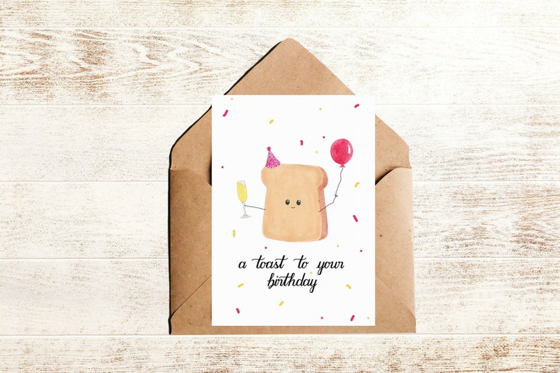 Geburtstagskarte mit Spruch a toast to your birthday und Illustration eines Toasts mit Sektglas und Luftballon