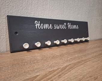 Modern decorative coat rack with lettering for hallway, entrance area etc.