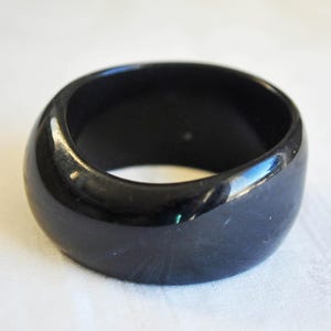 Asymmetric black Lucite bangle.  Wide chunky 1980s.