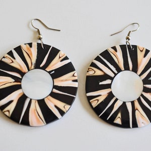 MOP, shell large flat, round earrings 4 pierced ears.  Central natural MOP circle, surrounded by black and caramel coloured abstract stripes