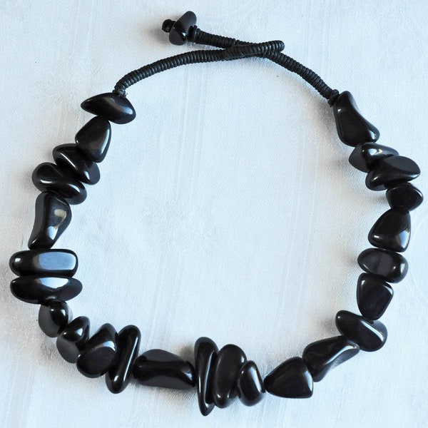 Shiny black Sobral collar necklace.  Free form, wedge shaped beads.  Hand made, Jackie Brazil, large resin bead necklace.  Probably 1990s.