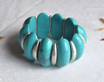 Faux turquoise lucite bracelet.  Sky blue, marbled, domed, panel stretch 1960s, 1970s bracelet.  Silver toned smaller panels between.  Boho.