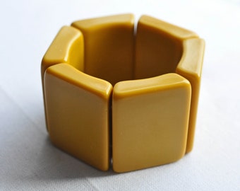 Mustard Bakelite large panel bracelet.  Deco, Designer, thick wedges strung on 2 strands of multiple nylon strands.  Early Sobral?  1960s.
