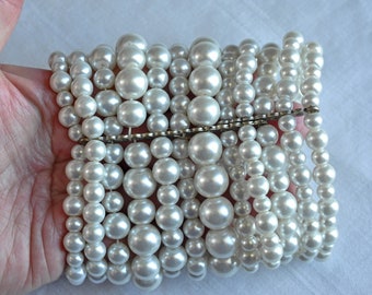 Extra wide faux pearl cuff bracelet.  12 strands of beautiful shiny pearls in varying sizes.  Brutalist, 80s, Bridal, multi strand bracelet.
