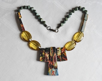 Laminated Wood bib necklace.  Floral print laminated to wooden trapezoids.  Faceted citrine acrylic, flat oval beads, small cube wood beads.