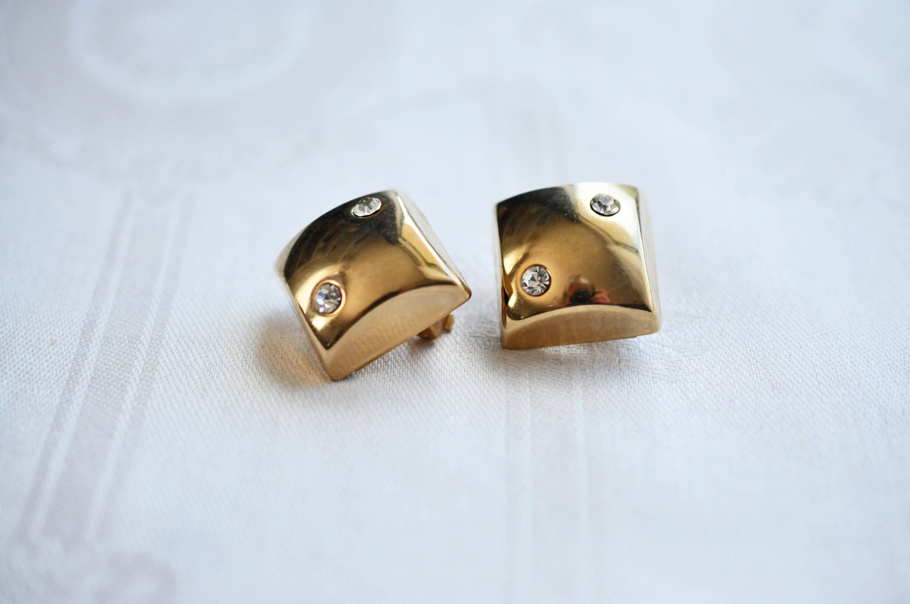Diamond Shaped Brass Clip on Earrings. 2 Rhinestones Adorn 