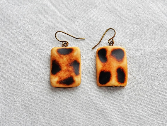 Carved animal print Galalith earrings.  Carved in… - image 1