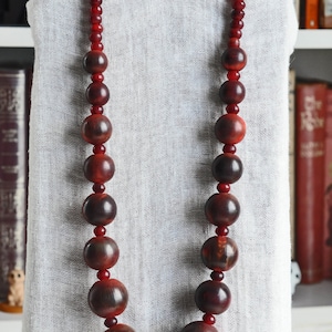 round-bone-bead-necklace-gerda-lynggaard-for-monies-dyed-deep-red