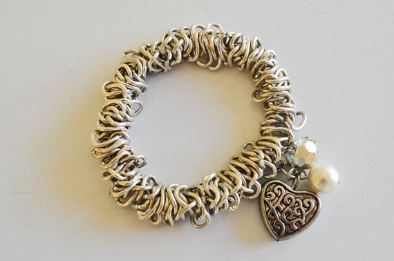 Silver chain mail, stretch bracelet with a Repous… - image 1