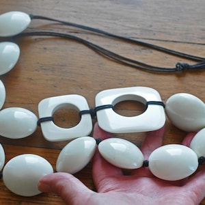 Amazing Gerda Lynggaard for Monies long Horn/Nail and Lucite over-sized Runway necklace.  The hollow Horn beads are resin dipped.  80s, 90s.