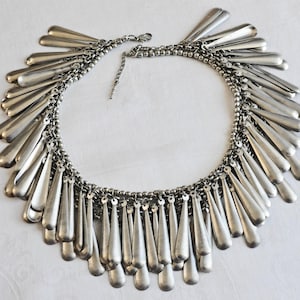 Extra large metal fringe, collar necklace.  2 layers of long, thin, silver metal drops encircle the necklace.  Egyptian Revival, 1980, 90s.