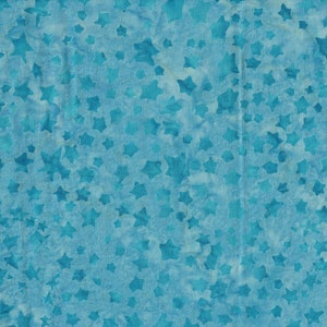 May include: A blue fabric with a white star pattern. The fabric has a slightly wrinkled texture.