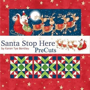 May include: Santa Stop Here PreCuts fabric collection by Karen Tye Bentley. The fabric features a red background with white stars and a festive scene of Santa Claus in his sleigh with reindeer flying through the night sky. The fabric is pre-cut into squares for quilting projects.