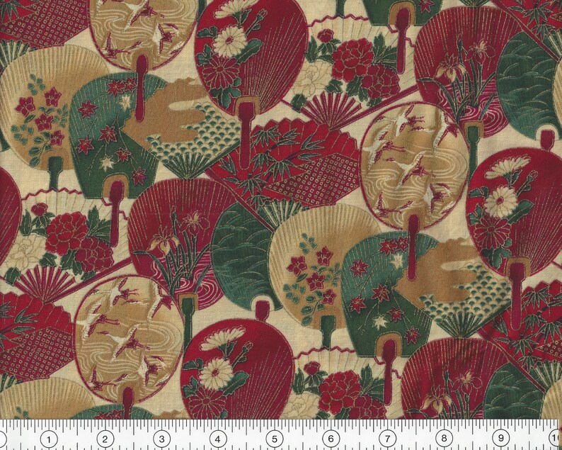 May include: A beige fabric with a repeating pattern of red, green and gold fans. The fans are decorated with floral and bird motifs.