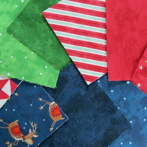 48 Precuts 5x5-inch from the Santa Stop Here fabric collection with coordinating Toscana's by Northcott . They have been straight rotary hand cut by me. Designed by Karen Tye Bentley, these medium weight cottons are easy to sew with a soft hand.