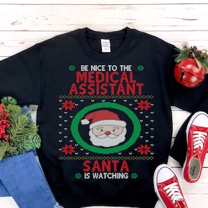 Medical Assistant Ugly Christmas Sweatshirt, Nurse and Hospital Staff Holiday Shirt Unisex Heavy Blend Crewneck Sweatshirt image 1