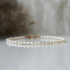 Sierlijke ivoren zoetwaterparelarmband 1,5-2 mm sterlingzilver