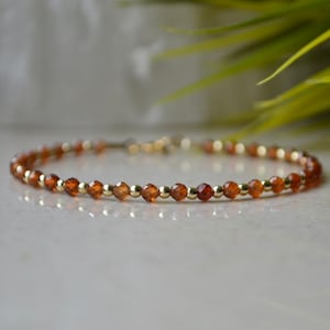 Spessartine Garnet bracelet - Orange crystal bracelet, bracelet femme, delicate burnt orange jewelry with Gold Hematite, 3mm skinny bracelet